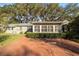 House back exterior view with brick patio at 1728 Se 8Th St, Ocala, FL 34471