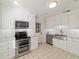 Modern kitchen with white cabinets and stainless steel appliances at 1728 Se 8Th St, Ocala, FL 34471