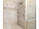 Walk-in shower with tiled walls and built-in seat at 1728 Se 8Th St, Ocala, FL 34471