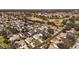 Aerial view of community, showing homes and a golf course at 17370 Se 76Th Flintlock Ter, The Villages, FL 32162