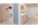 Bathroom features a tub, shower, vanity, and toilet at 17370 Se 76Th Flintlock Ter, The Villages, FL 32162