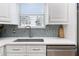 Modern kitchen with a sink and dishwasher at 17370 Se 76Th Flintlock Ter, The Villages, FL 32162