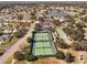 Aerial view of community tennis courts near golf course at 17370 Se 76Th Flintlock Ter, The Villages, FL 32162