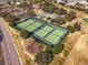 Well-maintained community tennis courts at 17370 Se 76Th Flintlock Ter, The Villages, FL 32162