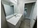 Bathroom with white vanity, quartz countertop and view to another room at 1776 Sw 161St Pl, Ocala, FL 34473