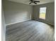 Bright bedroom with wood-look floors and a window at 1776 Sw 161St Pl, Ocala, FL 34473