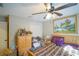 Guest bedroom with ceiling fan and closet at 201 Emerald Loop Pass, Ocala, FL 34472