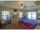 Bright bedroom with a ceiling fan and plenty of natural light at 201 Emerald Loop Pass, Ocala, FL 34472