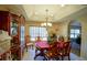 Formal dining room with a wooden table, chairs, and a china cabinet at 201 Emerald Loop Pass, Ocala, FL 34472