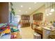 Well-equipped kitchen with dark wood cabinets, granite countertops, and an island at 201 Emerald Loop Pass, Ocala, FL 34472