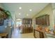 Kitchen with dark wood cabinets, granite countertops, and stainless steel appliances at 201 Emerald Loop Pass, Ocala, FL 34472