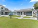 Landscaped backyard with walkway and screened porch at 20921 Sw 36Th St, Dunnellon, FL 34431