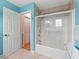 Clean bathroom with a shower/tub combo and light blue walls at 20921 Sw 36Th St, Dunnellon, FL 34431