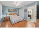 Bedroom with wood floors and en-suite bathroom at 20921 Sw 36Th St, Dunnellon, FL 34431