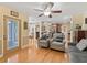 Living room with hardwood floors, comfy seating and kitchen view at 20921 Sw 36Th St, Dunnellon, FL 34431