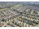 Aerial view of a large community with golf course at 2304 Grenadier Way, The Villages, FL 32162