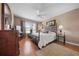 Guest bedroom with wood floors and ceiling fan at 2304 Grenadier Way, The Villages, FL 32162