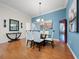 Spacious dining room featuring hardwood floors and stylish decor at 2304 Grenadier Way, The Villages, FL 32162