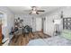 Bright bedroom with wood-look floors, a desk workspace, and ample closet space at 2575 Se 34Th St, Ocala, FL 34471