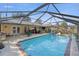 Inviting screened pool with ample deck space for sunbathing at 2575 Se 34Th St, Ocala, FL 34471