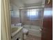 Bathroom with tub/shower combo and vanity at 36904 Ridge Rd, Fruitland Park, FL 34731