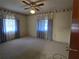 Bright bedroom with carpet and window coverings at 36904 Ridge Rd, Fruitland Park, FL 34731