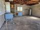 Spacious garage with concrete floor and overhead door at 36904 Ridge Rd, Fruitland Park, FL 34731