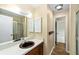 Brown vanity sink, mirror and shower in this bathroom at 3827 Ne 17Th Street Cir, Ocala, FL 34470