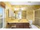 Bathroom with yellow vanity and bamboo wallpaper at 3827 Ne 17Th Street Cir, Ocala, FL 34470