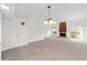 Bright dining room featuring a chandelier and fireplace at 3827 Ne 17Th Street Cir, Ocala, FL 34470