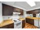 White appliances and wood cabinets in this kitchen at 3827 Ne 17Th Street Cir, Ocala, FL 34470