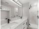 Modern bathroom with double vanity and marble shower at 4335 Sw 159Th Ave, Ocala, FL 34481