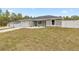 New construction home with a gray exterior and white fence at 4335 Sw 159Th Ave, Ocala, FL 34481