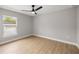 Simple bedroom with ceiling fan and wood-look floors at 4353 Sw 159Th Ave, Ocala, FL 34481