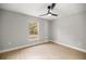 Well-lit bedroom with ceiling fan and wood-look floors at 4353 Sw 159Th Ave, Ocala, FL 34481