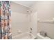 Bathroom with tub shower combination, and floral shower curtain at 4535 Nw 34Th Pl, Ocala, FL 34482