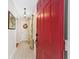 Bright entryway with red door and tiled floor at 4535 Nw 34Th Pl, Ocala, FL 34482