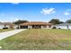 Tan house with brown roof, screened porch, and spacious yard at 4535 Nw 34Th Pl, Ocala, FL 34482