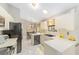 Well-equipped kitchen featuring white cabinets and black appliances at 4535 Nw 34Th Pl, Ocala, FL 34482