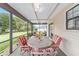 Enjoy this lovely screened patio with table and chairs at 4535 Nw 34Th Pl, Ocala, FL 34482