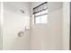 Simple shower with white tile and a window at 4535 Nw 34Th Pl, Ocala, FL 34482