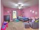 Charming bedroom with pink walls and playful decor at 4730 Se 31St St, Ocala, FL 34480