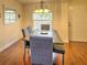 Formal dining room with hardwood floors and a wood table at 4730 Se 31St St, Ocala, FL 34480