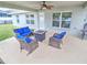 Relaxing covered patio with wicker furniture at 4730 Se 31St St, Ocala, FL 34480