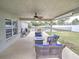 Covered patio with seating area and fire pit at 4730 Se 31St St, Ocala, FL 34480