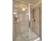 Large walk-in shower with tiled walls and glass enclosure at 4730 Se 31St St, Ocala, FL 34480