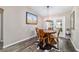 Bright dining area with wooden table and unique chandelier at 4933 Sw 109Th Loop, Ocala, FL 34476