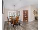 Dining room features a wooden table, built-in shelving and hardwood floors at 4933 Sw 109Th Loop, Ocala, FL 34476