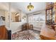 Charming bar area with rustic wooden cabinets, a zebra print rug, and unique lighting at 4933 Sw 109Th Loop, Ocala, FL 34476