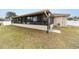 View of house exterior showcasing sunroom addition at 4933 Sw 109Th Loop, Ocala, FL 34476